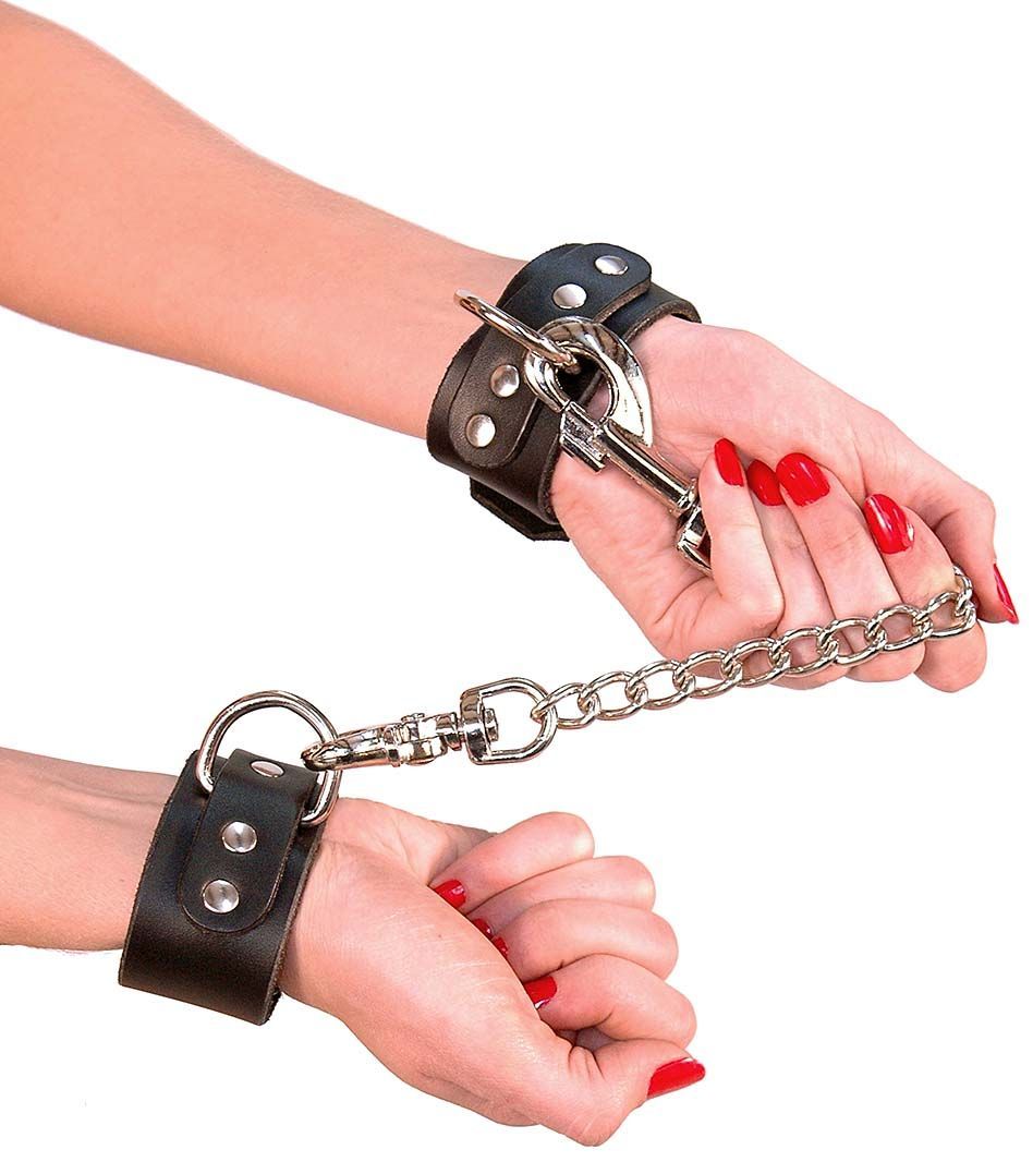 biker chick wearing D-ring leather wristlets with chain