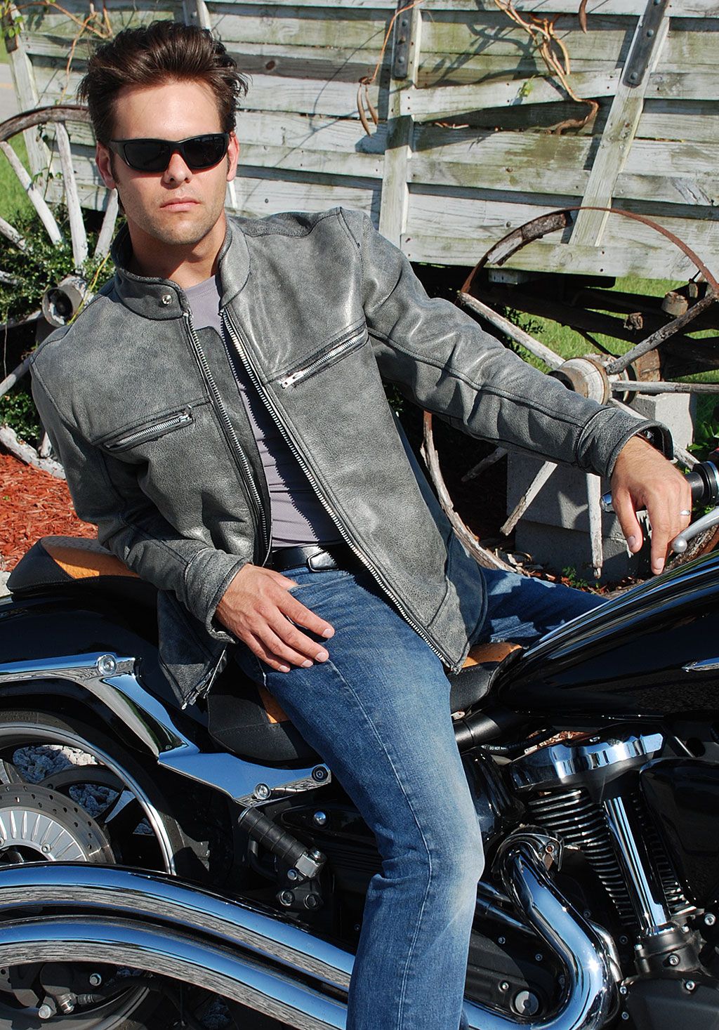  Biker wearing a leather jacket on motorcycle